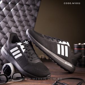 branded black sports shoes