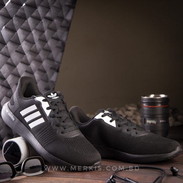 branded black sports shoes
